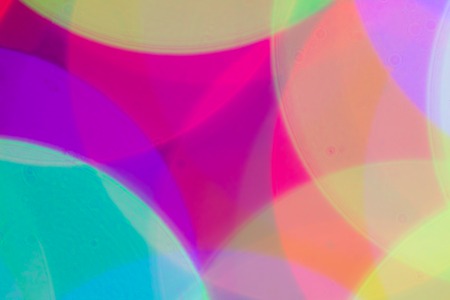 Blurred and defocused abstract multicolor background with christmas lights, soft multicolored bokeh circles.の写真素材