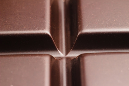 Dark, bitter chocolate in cubes shape, close-up view.の写真素材