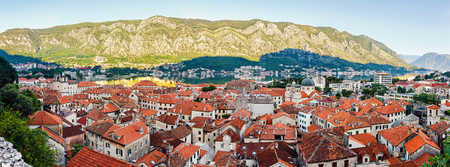 Panoramic view from above on old historical city Kotor, with orange tiling roofs, morning time, Montenegro.の写真素材