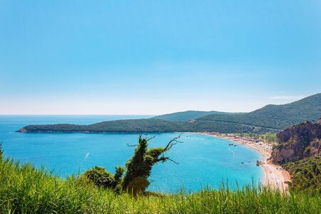 Panoramic view from above to the Adriatic sea coastline and Jaz beach near a Budva city, Montenegro.の写真素材