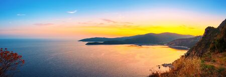 Panoramic view from above to the Adriatic sea coastline with Jaz beach at sunset time, Montenegro.の写真素材