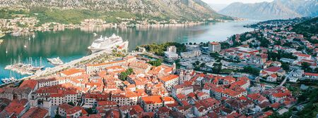 Cityscape of old city Kotor, bay in Adriatic sea surrounded by mountains, Montenegro. Panoramic view from above.の写真素材
