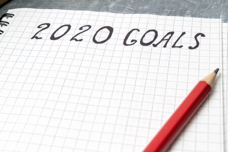2020 goals, text on the paper in notepad, close up view New Year promises concept.の写真素材