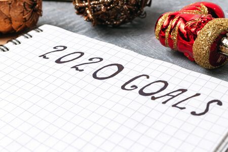 2020 goals, text on the paper in notepad, close up view New Year promises concept.の写真素材