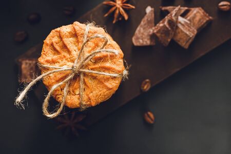 Homemade cookies on dark background, top view.