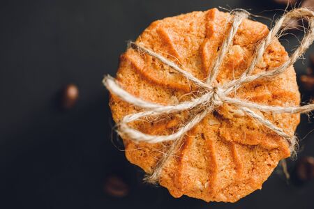 Homemade cookies on dark background, top view.