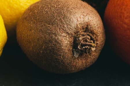 One whole kiwi fruit close-up view.の写真素材