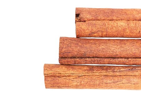 Cinnamon sticks isolated on white background, close-up, top view.