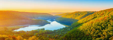 Vivid sunrise landscape in the national nature park Podilski Tovtry, canyon and Studenytsia river is tributary of Dnister river, view from above.の写真素材