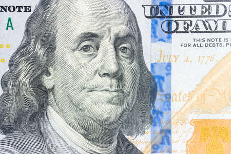 Benjamin Franklin portrait from hundred dollar bill, close-up view.の写真素材
