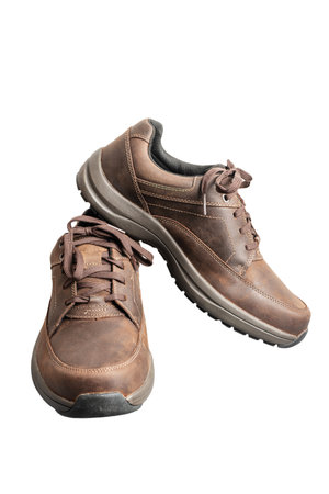 Mens brown leather walking shoes isolated on white background.