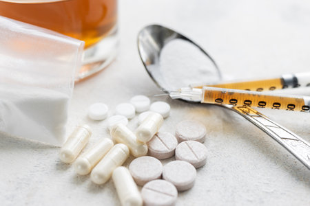 Narcotic substances in spoon, dope powder in transparent plastic bag, syringes with drugs dose,...