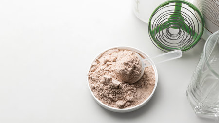 Whey protein powder in measuring scoop.の写真素材