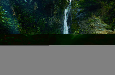 photo of a hidden waterfall, which is in Indonesia, a waterfall with a small water dischargeの写真素材
