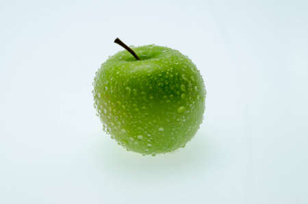 Green apple isolated on white backgroundの写真素材