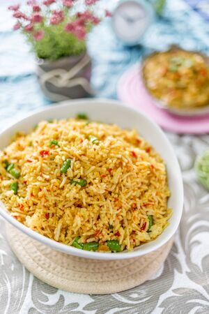 A plate of delicious home cooked fried rice which is popular in Malaysia, Indonesia, Thailand and Singaporeの写真素材