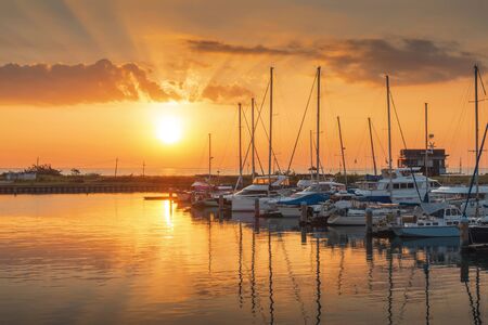 Boats and marina with beautiful sunsetの写真素材
