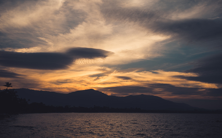 Image of sea or ocean and mountain with beautiful  background in the evening timeの写真素材