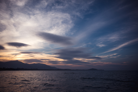 Image of sea or ocean and mountain with beautiful  background in the evening timeの写真素材