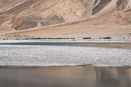 Landscape image of the blue Shyok river on the way to Nubra valley , Ladakh Indiaの写真素材