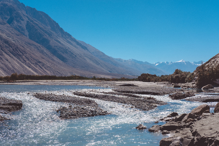Landscape image of the blue Shyok river on the way to Nubra valley with mountain and blue sky background , Ladakh Indiaの写真素材