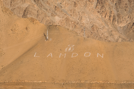 Landscape image of mountains with the word Lamdon in Ladakh , India