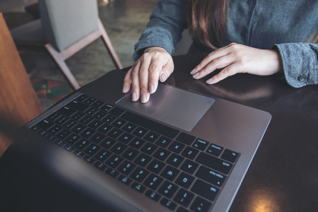 Topview image of a business woman's hands working and typing on laptop keyboard on the tableの写真素材