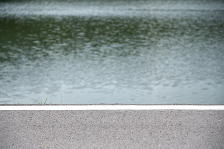 Closeup image of the road and lakeの写真素材