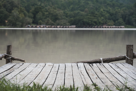 An old wooden pier by the river backgroundの写真素材