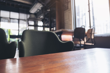 Wooden table and chairs in cafeの写真素材