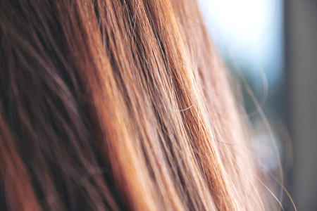 Closeup image of a woman with brown hairの写真素材