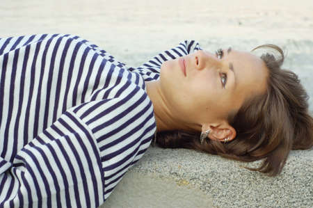 Girl resting in the striped vestの写真素材
