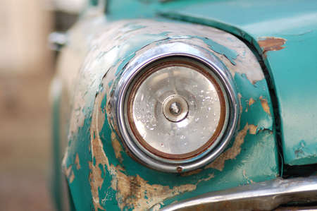 rusting car headlightの写真素材