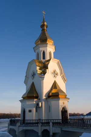 Orthodox church on river Dnipro in the evening.  Kiev, Ukraine.