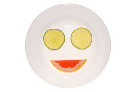 Smile from a lime and grapefruit on isolatedの写真素材