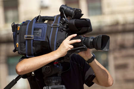 Cameraman working in the street 