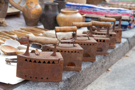 Vintage irons on a marketの写真素材