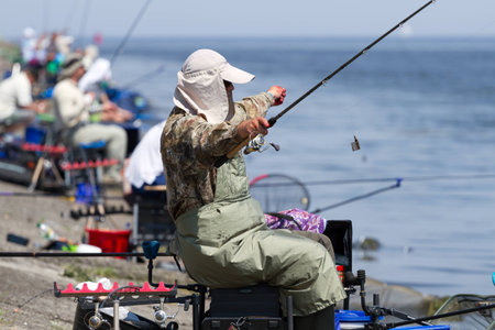 VYSHGOROD, UKRAINE - JUNE 7, 2014: Fshing competition "Fishing Feeder Cup of Ukraine" on the municipal embankment of the Kyiv sea in Vyshgorod , Ukraineのeditorial素材
