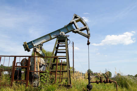 Working oil pump on the background blue skyの写真素材