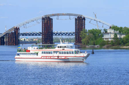KIEV,UKRAINE - MAY 02, 2016: Tourist pleasure boats on the Dnepr River and river shore in historical area. Kiev. Ukraineのeditorial素材