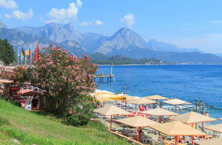 Kemer, Turkey - June 20, 2018:Flowers Oleander and umbrellas on the central beach in Kemer, Turkeyのeditorial素材