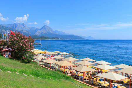 Kemer, Turkey - June 20, 2018:Central city beach with Oleander flowers and beach umbrellas in Kemer, Turkeyのeditorial素材