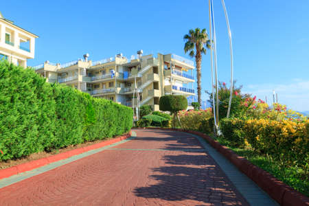 Kemer, Turkey - June 20, 2018:Beautiful walkway with palm trees and buildings in Kemer, Turkeyのeditorial素材