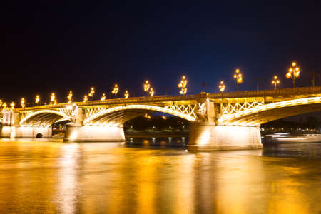 Bridge illuminated by lanterns in the evening in Budapest, Hungaryの写真素材