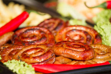 Grilled sausage with vegetables and potatoes at the christmas marketの写真素材