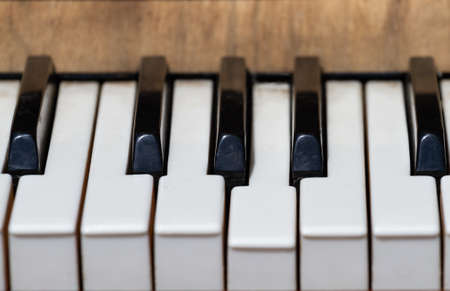 Black and white keys of an old street pianoの写真素材