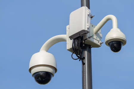  Pillar with outdoor security cameras on the  city 