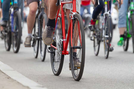 Group of people go by bicycles on the roadの写真素材
