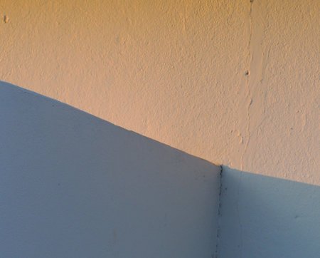 White wall with shadow and sunlight. Background and texture for design.の写真素材