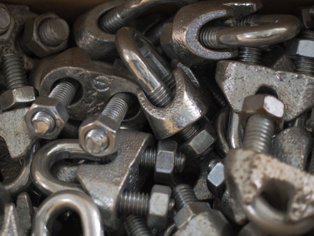 Close-up of nuts and bolts piled up in a box.の写真素材